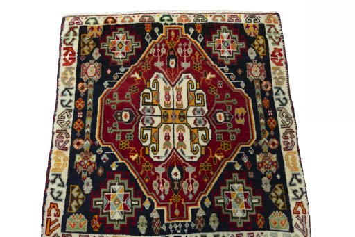 Surface texture of 2000s Shiraz rug with natural Wool and intricate pattern