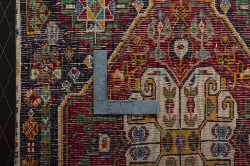 Backside of handmade 2000s Shiraz rug showing knot structure and weave density