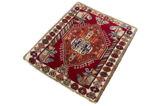 Corner detail of 2000s Shiraz rug showing border pattern and Wool pile