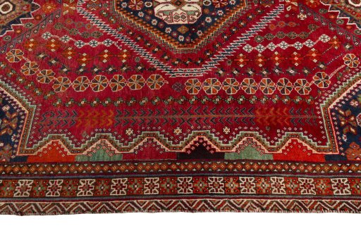 Corner detail of 2000s Shiraz rug showing border pattern and Wool pile