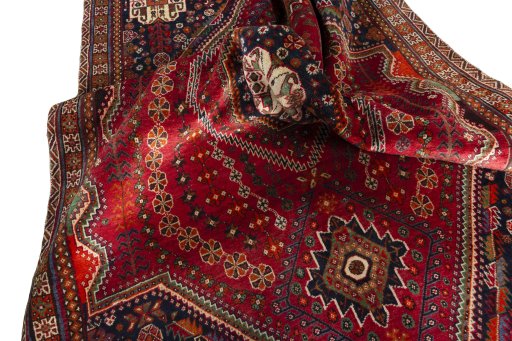 Surface texture of 2000s Shiraz rug with natural Wool and intricate pattern