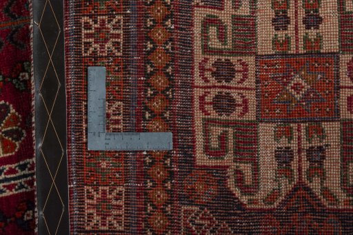 Backside of handmade 2000s Shiraz rug showing knot structure and weave density