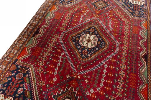 Backside of handmade 2000s Shiraz rug showing knot structure and weave density