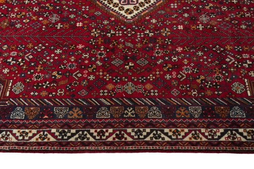 Corner detail of 2000s Shiraz rug showing border pattern and Wool pile