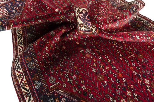 Surface texture of 2000s Shiraz rug with natural Wool and intricate pattern