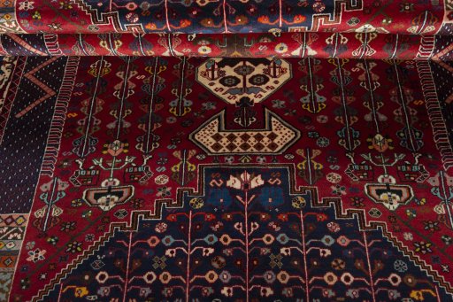 Corner detail of 2000s Shiraz rug showing border pattern and Wool pile