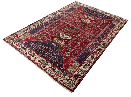 Corner detail of 2000s Shiraz rug showing border pattern and Wool pile