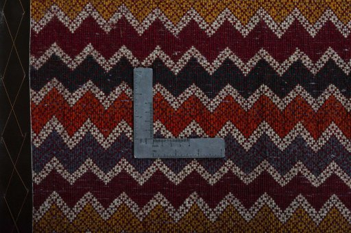 Backside of handmade 2000s Shiraz rug showing knot structure and weave density