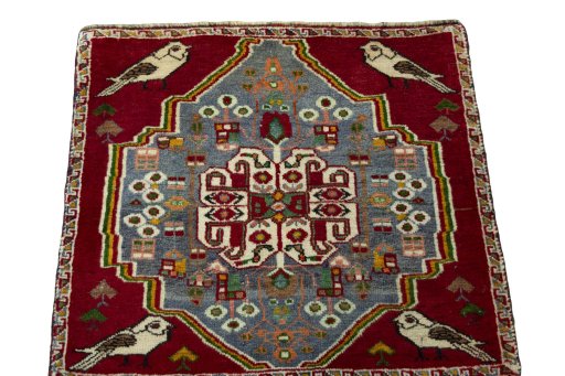 Surface texture of 2000s Shiraz rug with natural Wool and intricate pattern