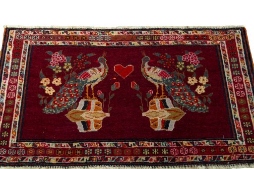 Surface texture of 2000s Shiraz rug with natural Wool and intricate pattern