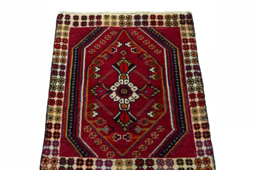 Surface texture of 2000s Shiraz rug with natural Wool and intricate pattern