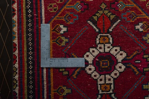 Backside of handmade 2000s Shiraz rug showing knot structure and weave density
