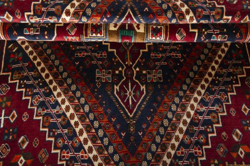 Corner detail of 2000s Shiraz rug showing border pattern and Wool pile