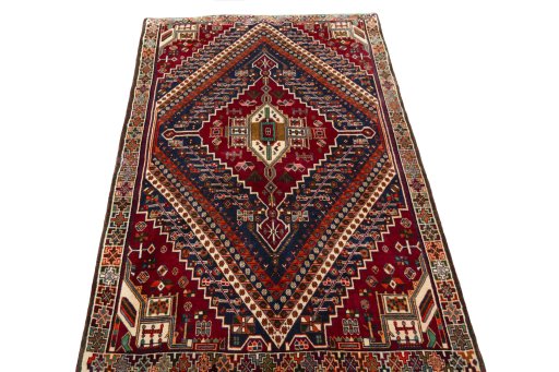 Surface texture of 2000s Shiraz rug with natural Wool and intricate pattern