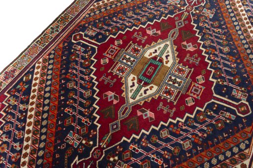 Backside of handmade 2000s Shiraz rug showing knot structure and weave density