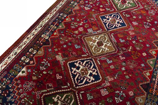 Backside of handmade 2000s Shiraz rug showing knot structure and weave density