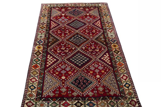Surface texture of 2000s Shiraz rug with natural Wool and intricate pattern