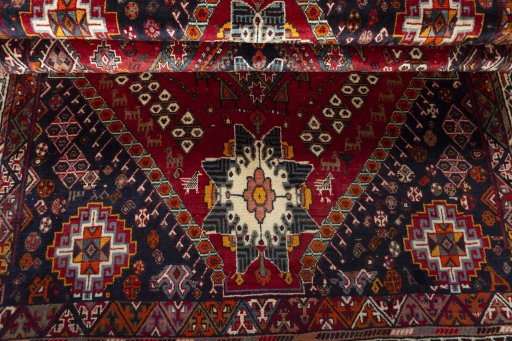 Corner detail of 2000s Shiraz rug showing border pattern and Wool pile