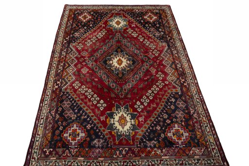 Surface texture of 2000s Shiraz rug with natural Wool and intricate pattern