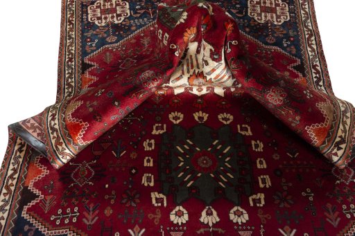 Corner detail of 2000s Shiraz rug showing border pattern and Wool pile