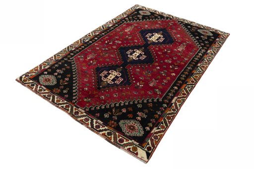 Corner detail of 2000s Shiraz rug showing border pattern and Wool pile
