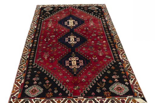 Surface texture of 2000s Shiraz rug with natural Wool and intricate pattern