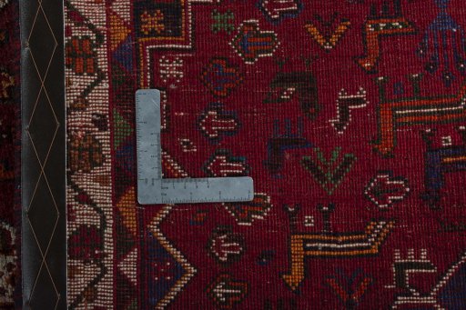 Corner detail of 2000s Shiraz rug showing border pattern and Wool pile