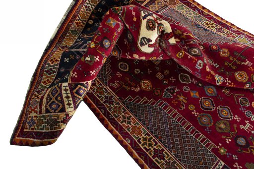 Corner detail of 2000s Shiraz rug showing border pattern and Wool pile