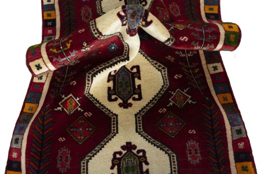 Corner detail of 2000s Shiraz rug showing border pattern and Wool pile
