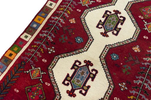 Backside of handmade 2000s Shiraz rug showing knot structure and weave density