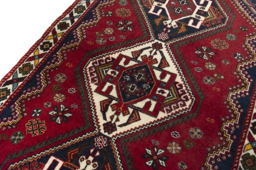 Backside of handmade 2000s Shiraz rug showing knot structure and weave density