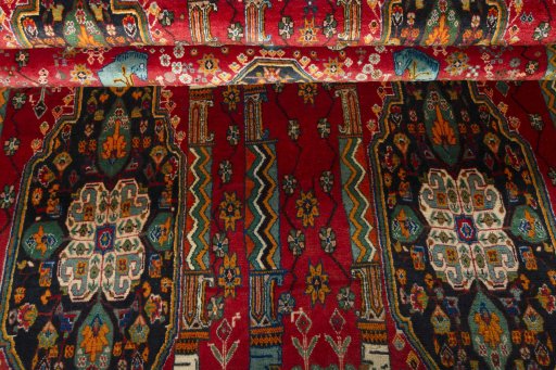 Corner detail of 2000s Shiraz rug showing border pattern and Wool pile