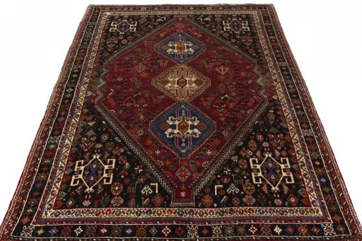 Surface texture of 2000s Shiraz rug with natural Wool and intricate pattern