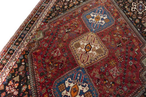 Backside of handmade 2000s Shiraz rug showing knot structure and weave density