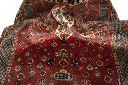 Surface texture of 2000s Shiraz rug with natural Wool and intricate pattern