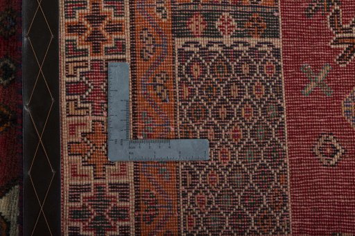 Backside of handmade 2000s Shiraz rug showing knot structure and weave density