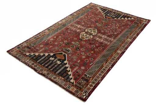 Corner detail of 2000s Shiraz rug showing border pattern and Wool pile