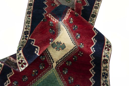 Corner detail of 2000s Shiraz rug showing border pattern and Wool pile