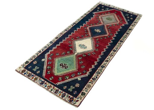 Corner detail of 2000s Shiraz rug showing border pattern and Wool pile