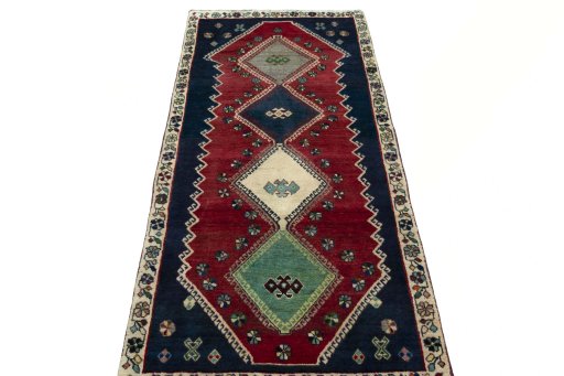 Surface texture of 2000s Shiraz rug with natural Wool and intricate pattern