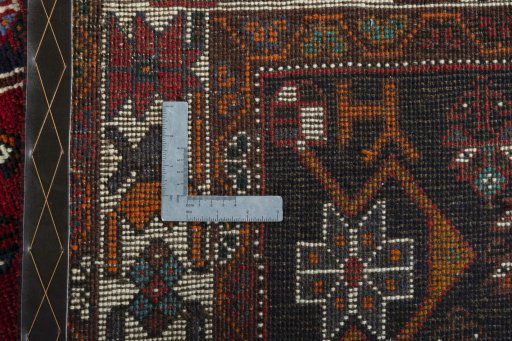 Surface texture of 2000s Shiraz rug with natural Wool and intricate pattern