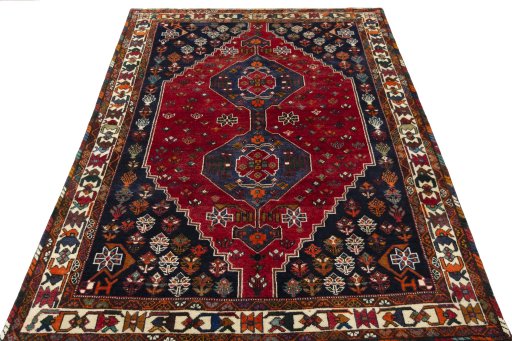 Surface texture of 2000s Shiraz rug with natural Wool and intricate pattern