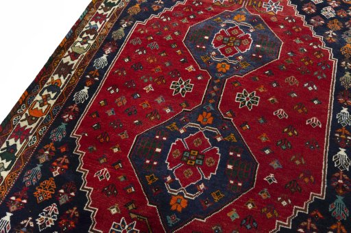 Backside of handmade 2000s Shiraz rug showing knot structure and weave density