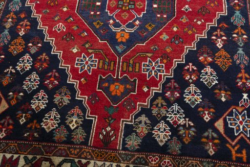 Central medallion detail of 2000s Shiraz rug from Iran / Persia