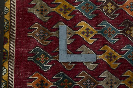 Backside of handmade 2000s Shiraz rug showing knot structure and weave density