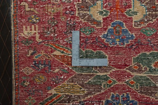 Backside of handmade 2000s Shiraz rug showing knot structure and weave density
