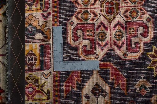 Surface texture of 2000s Shiraz rug with natural Wool and intricate pattern
