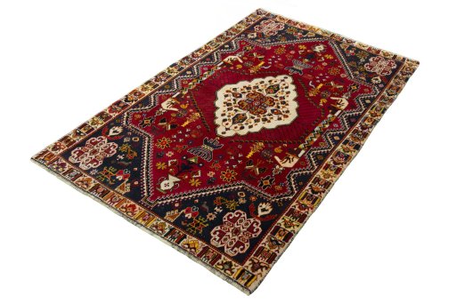 Corner detail of 2000s Shiraz rug showing border pattern and Wool pile