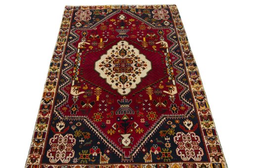 Surface texture of 2000s Shiraz rug with natural Wool and intricate pattern