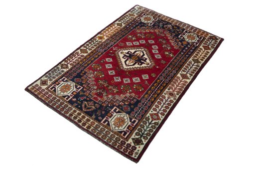 Corner detail of 2000s Shiraz rug showing border pattern and Wool pile